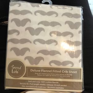 New in package moustache standard, fitted crib sheet.